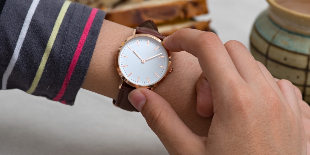Girl’s hand with wrist watches at the coffee break Girl’s hand with wrist watches at the coffee break