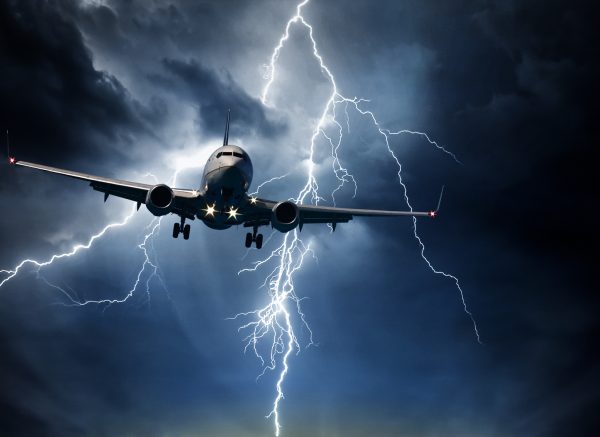 Jet travelling through stormy sky