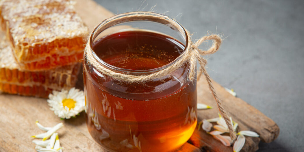 Delicious honey on dark backgroud Delicious honey on dark backgroud
