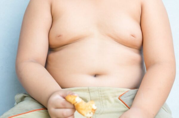 Big-obese-asian-fay-boy-eating-greasy-unhealthy-fried-food