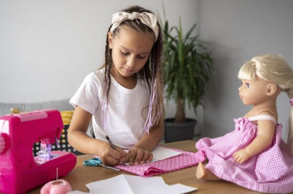 adorable-girl-sewing-clothes-by-hand