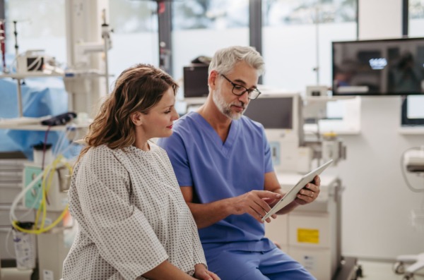 Doctor,Showing,Female,Patient,Mri,Scan,On,Tablet,,Discussing,Test Doctor,Showing,Female,Patient,Mri,Scan,On,Tablet,,Discussing,Test
