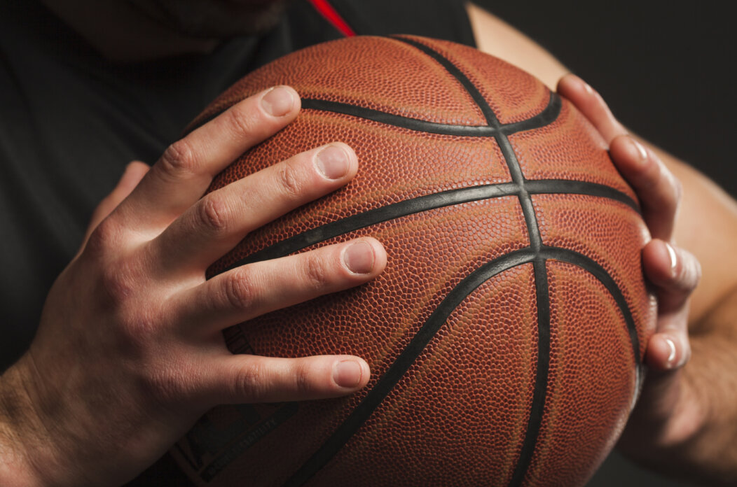 close-up-hand-held-basketball close-up-hand-held-basketball
