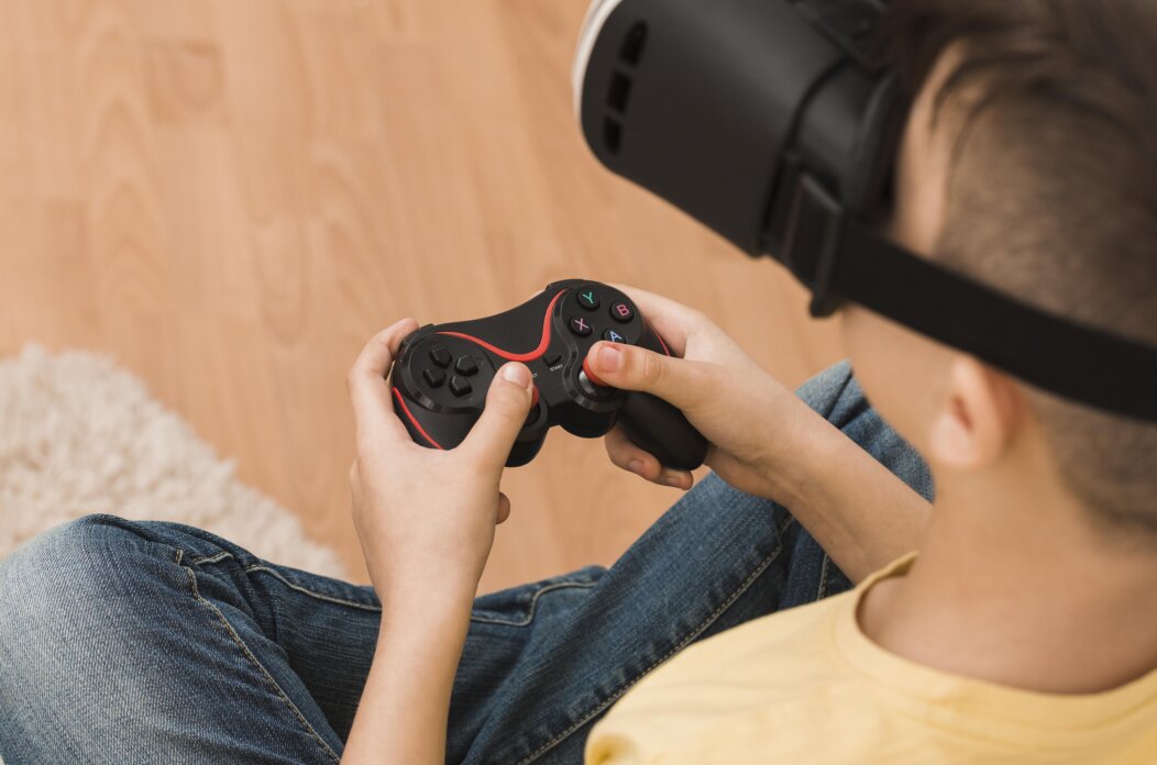 high-angle-boy-playing-video-games-with-virtual-reality-headset